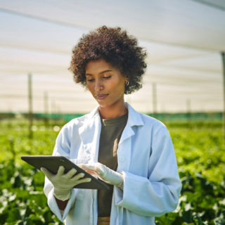 Agro scientist taking data in field